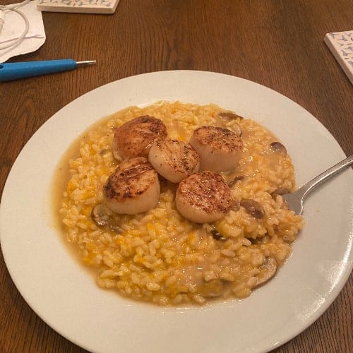 Seared Scallops over Wild Mushroom Risotto.